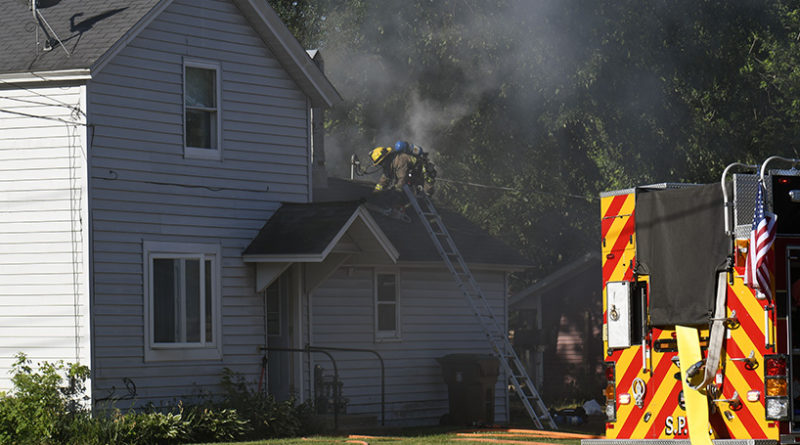 One woman dies in Thursday house fire; firefighters, officers injured